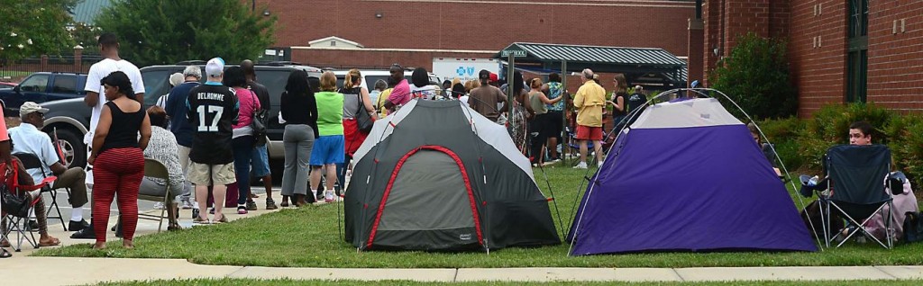 Hundreds line up for a free dental clinic at the First Baptist Church in Rock Hill Friday, August 8, 2014.